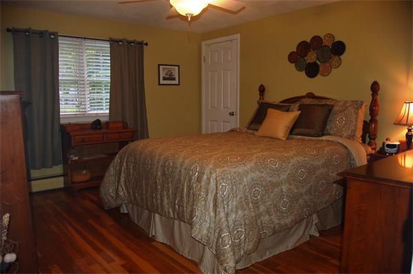145 Star Avenue Woonsocket, RI 02895 - Photo 12 of 20 a bed sitting in a bedroom next to a window