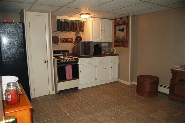 145 Star Avenue Woonsocket, RI 02895 - Photo 14 of 20 a kitchen with stainless steel appliances granite countertop a stove and a refrigerator