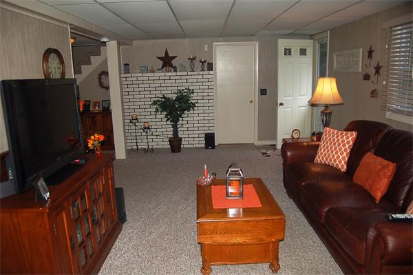 145 Star Avenue Woonsocket, RI 02895 - Photo 16 of 20 a living room with furniture and a flat screen tv