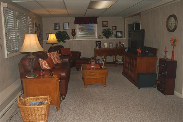 145 Star Avenue Woonsocket, RI 02895 - Photo 17 of 20 a living room with furniture and a flat screen tv