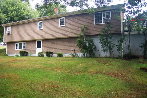 145 Star Avenue Woonsocket, RI 02895 - Photo 20 of 20 a front view of a house with a garden