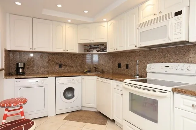 a living room with fireplace furniture and a flat screen tv