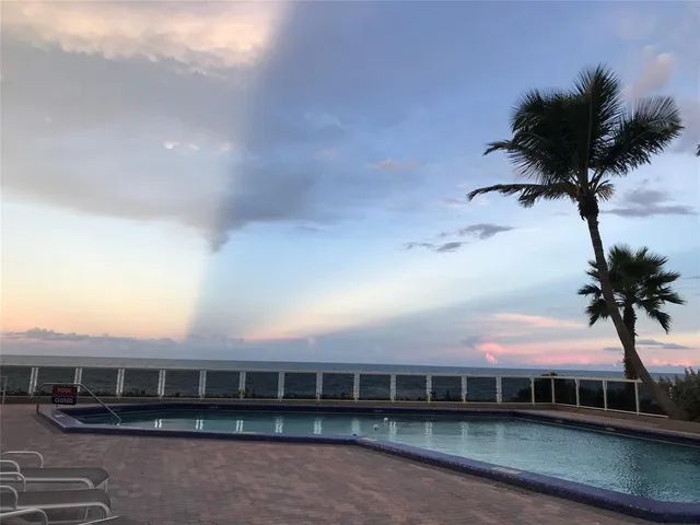 a view of a chairs and table in the patio