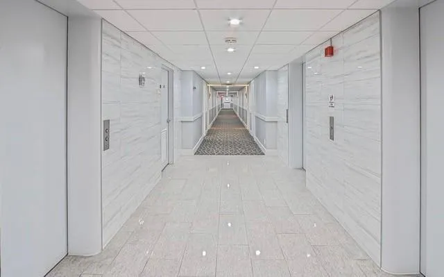 a bathroom with a sink mirror and vanity