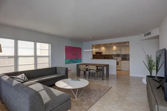 a kitchen with a table and chairs in it