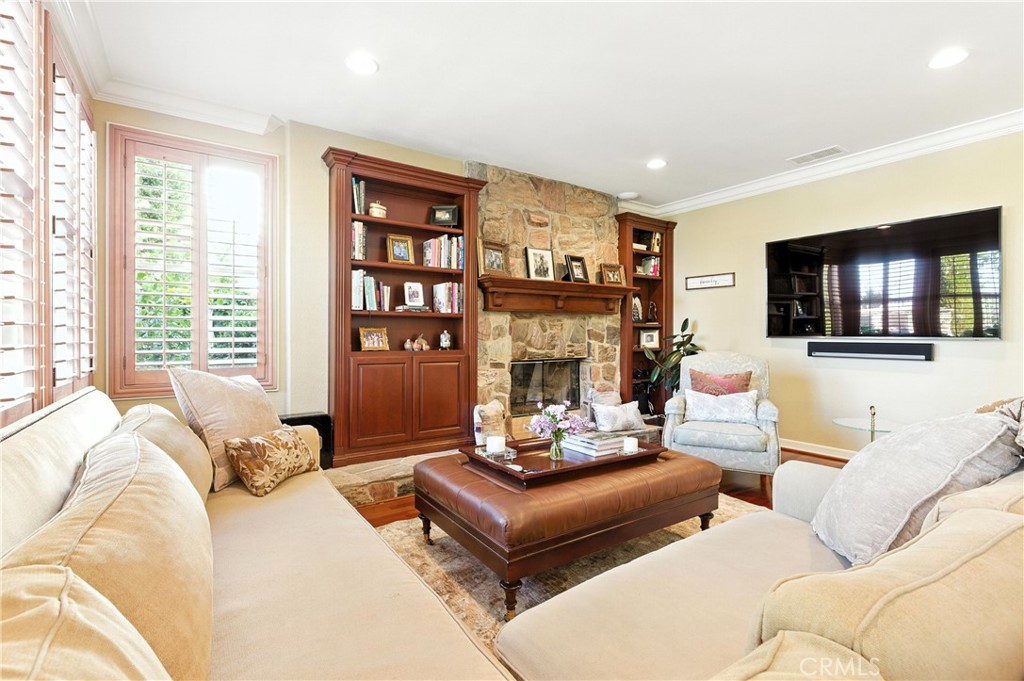 18 Asilomar Road Laguna Niguel, CA 92677 - Photo 21 of 75 a living room with furniture fireplace and a flat screen tv