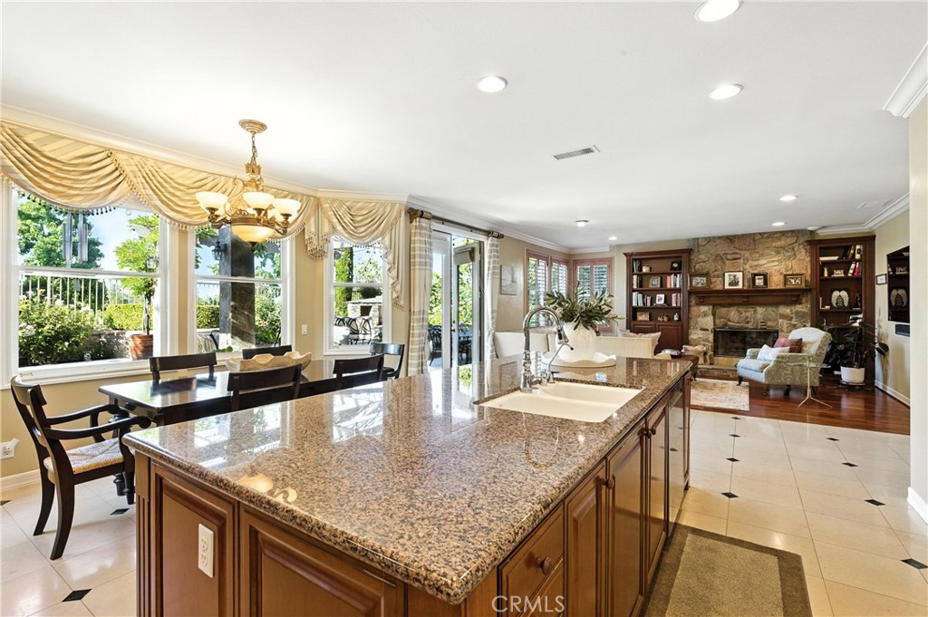 18 Asilomar Road Laguna Niguel, CA 92677 - Photo 23 of 75 a dining hall with stainless steel appliances granite countertop a kitchen island a stove and a sink