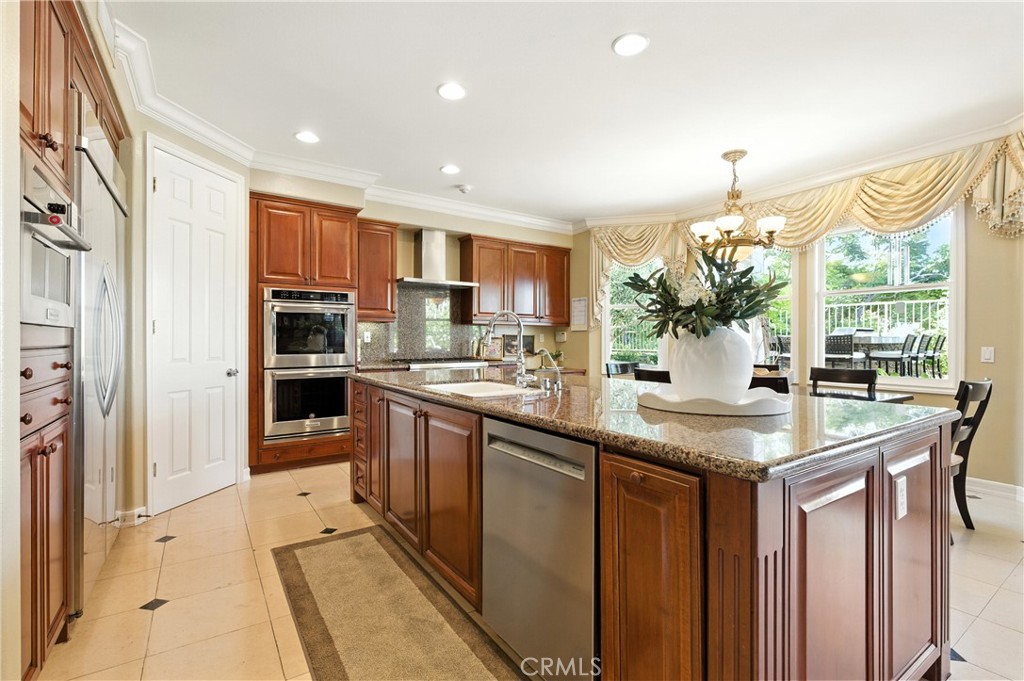 18 Asilomar Road Laguna Niguel, CA 92677 - Photo 24 of 75 a kitchen with stainless steel appliances granite countertop a refrigerator and a sink