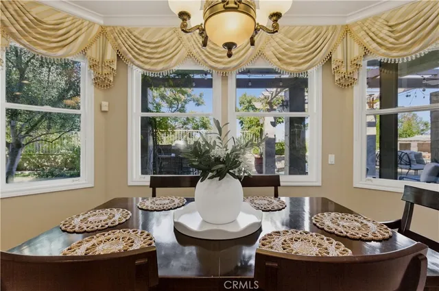 a view of a table and chairs in the patio