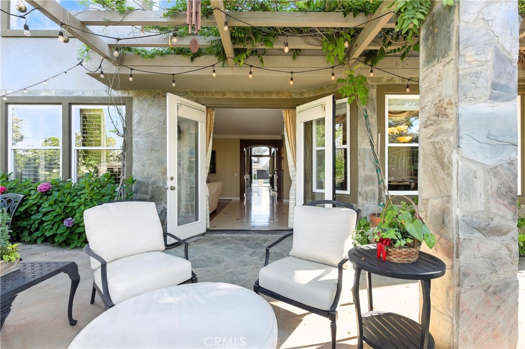 18 Asilomar Road Laguna Niguel, CA 92677 - Photo 31 of 75 a view of a patio with couches table and chairs and potted plants