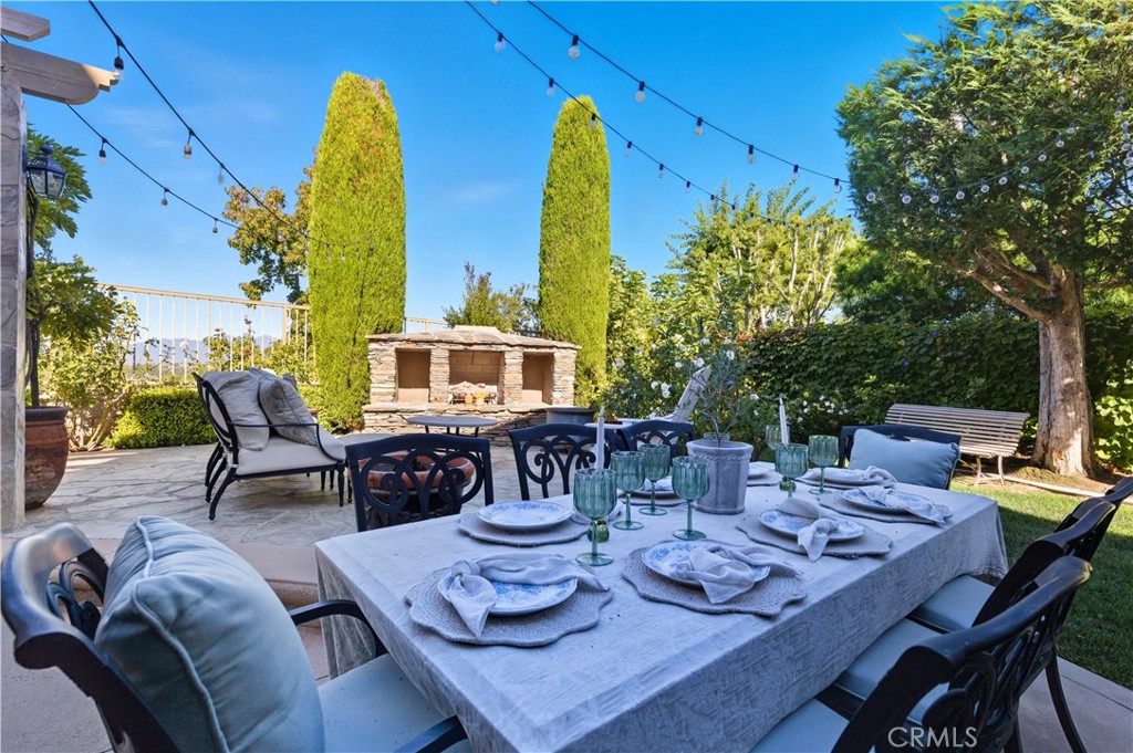 18 Asilomar Road Laguna Niguel, CA 92677 - Photo 36 of 75 a view of a dining table and chairs in the patio