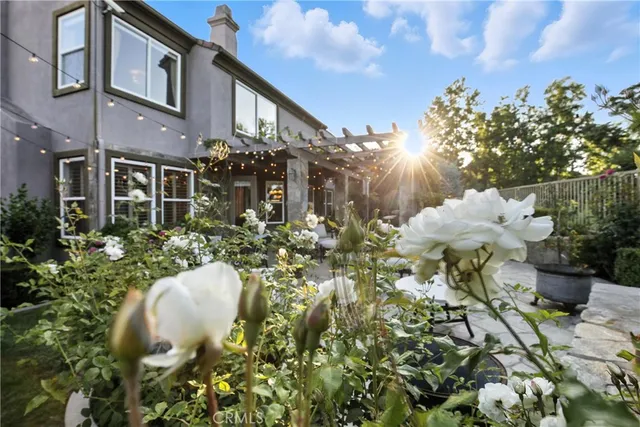 a living room with furniture a large window and a fireplace