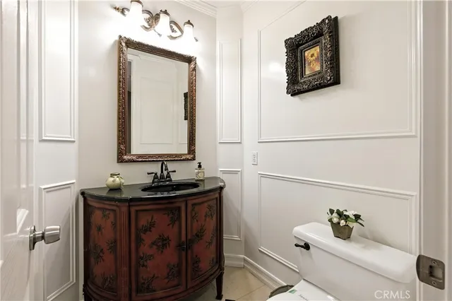 a bedroom with a bed and a dresser next to a window