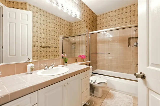 a bathroom with a sink double vanity and a mirror