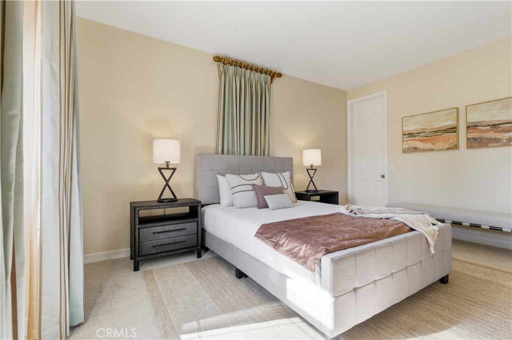 18 Asilomar Road Laguna Niguel, CA 92677 - Photo 65 of 75 a large bed sitting in a bedroom next to a window and flowerpot