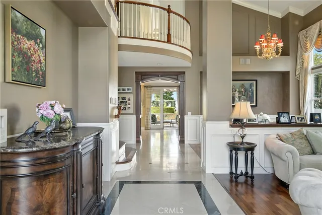 a living room with furniture a fireplace and a table