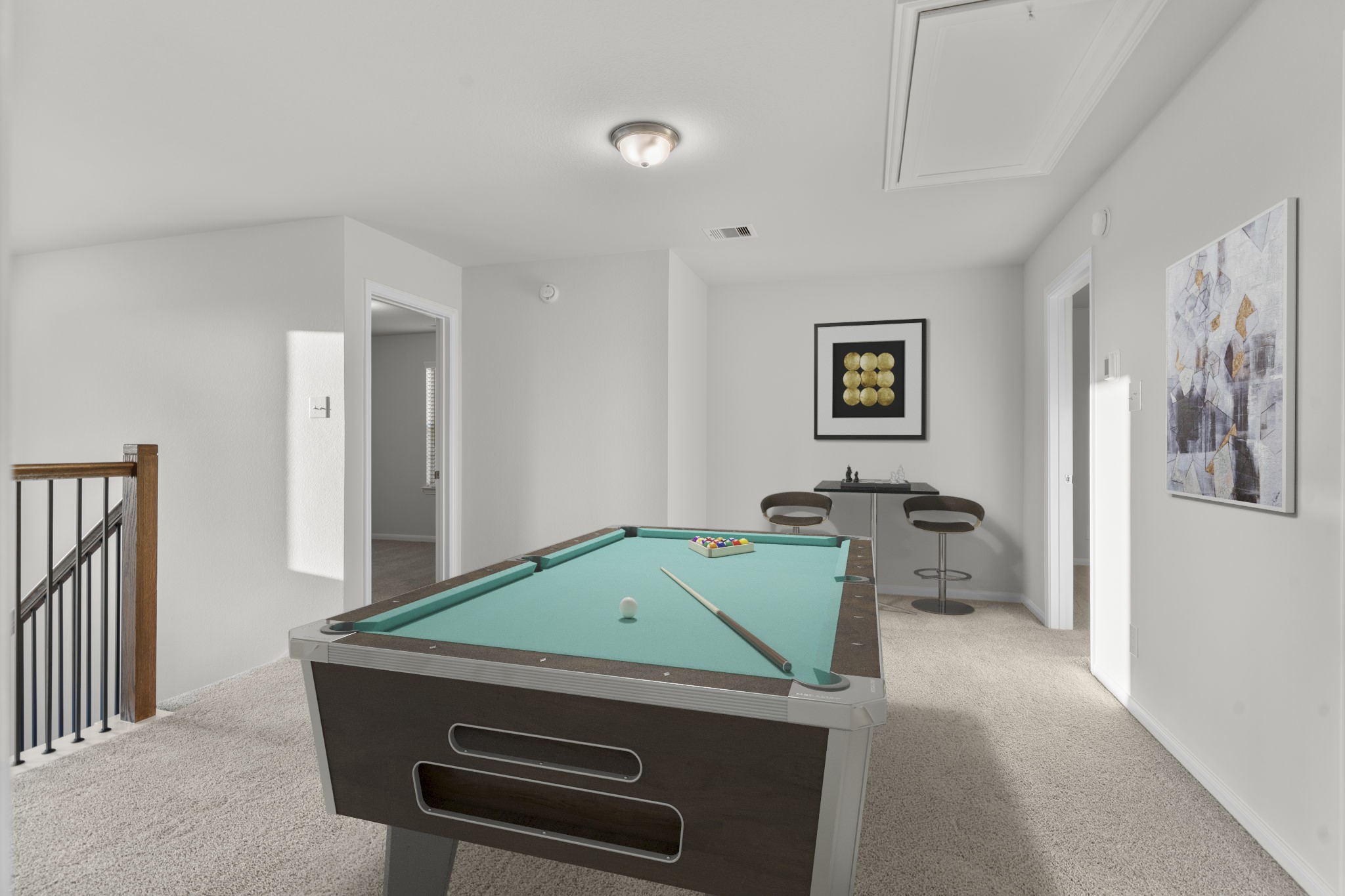 22223 Rome Breeze Drive Hockley, TX 77447 - Photo 22 of 46 Another virtually staged view of the game room highlights its open layout and natural flow overlooking the staircase. The soft carpeting, neutral tones, and abundant light create a comfortable, welcoming space for recreation and leisure.