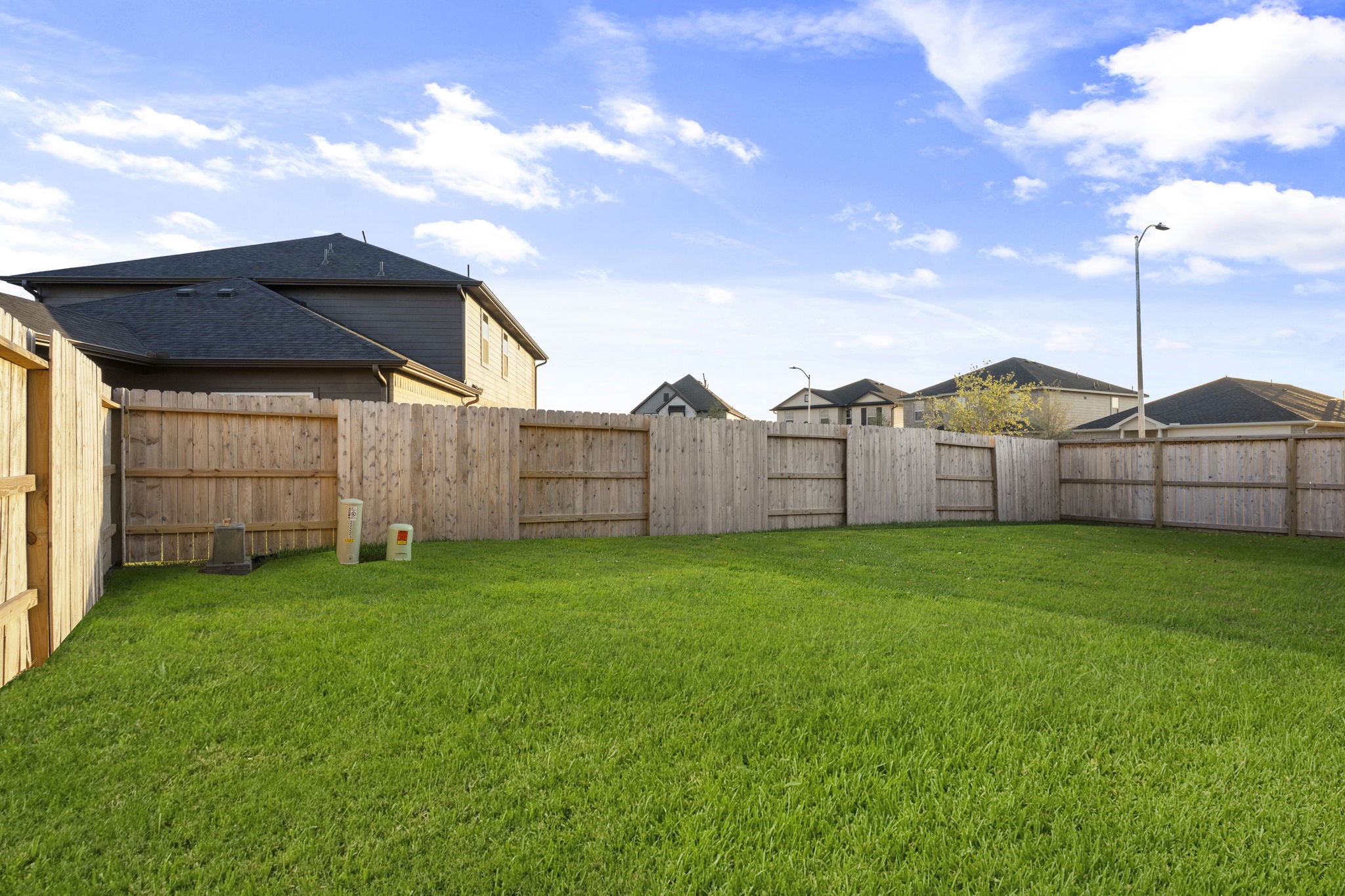 22223 Rome Breeze Drive Hockley, TX 77447 - Photo 28 of 46 The spacious backyard offers endless possibilities for play, gardening, or adding a future pool. Fully fenced for privacy, it provides a safe and open space for family gatherings or quiet afternoons outdoors.