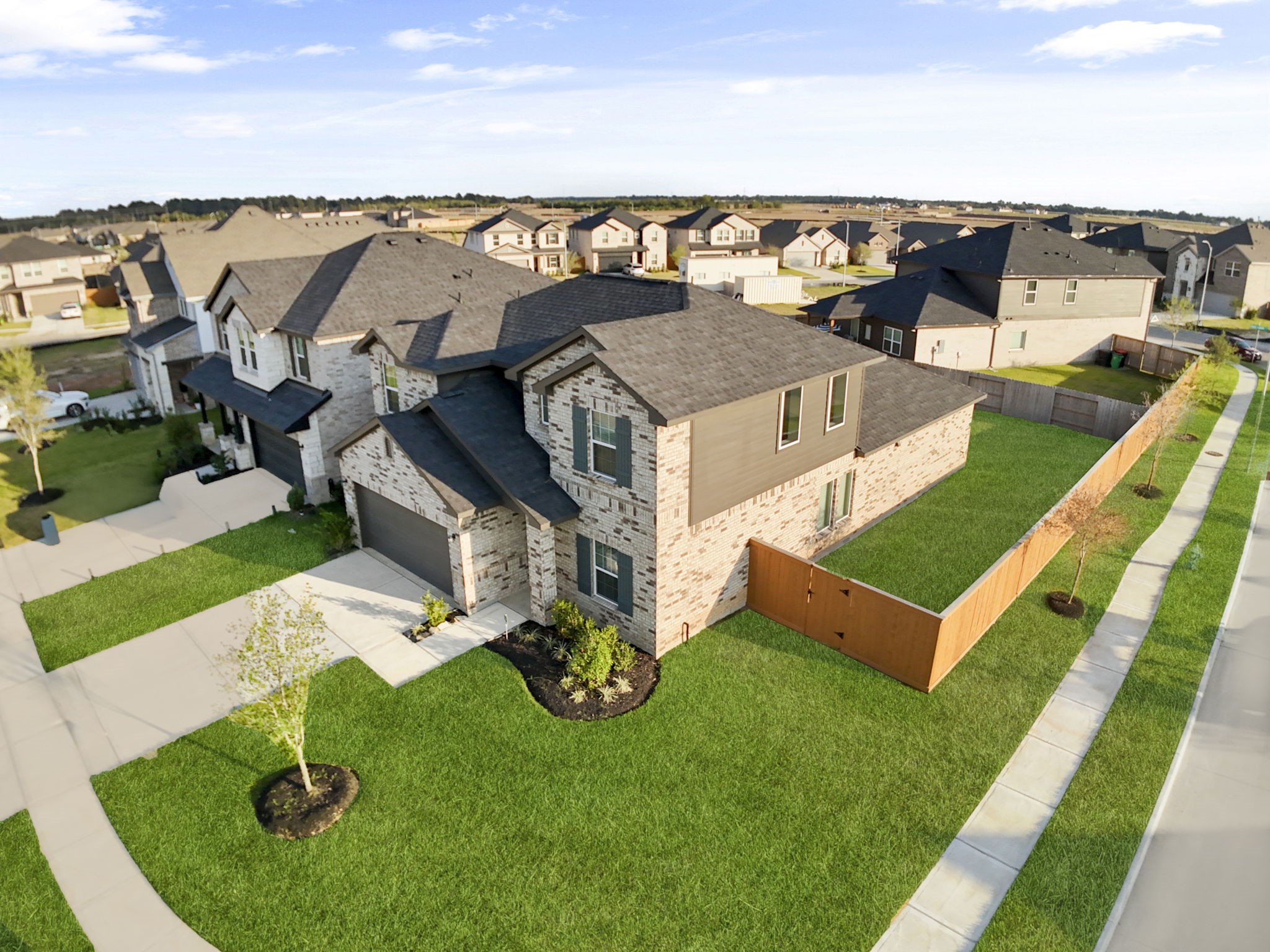 22223 Rome Breeze Drive Hockley, TX 77447 - Photo 33 of 46 Aerial views reveal how well the home sits on its corner lot, offering extra space and privacy from neighboring properties. You can also see the tidy landscaping and thoughtful layout of this attractive community.