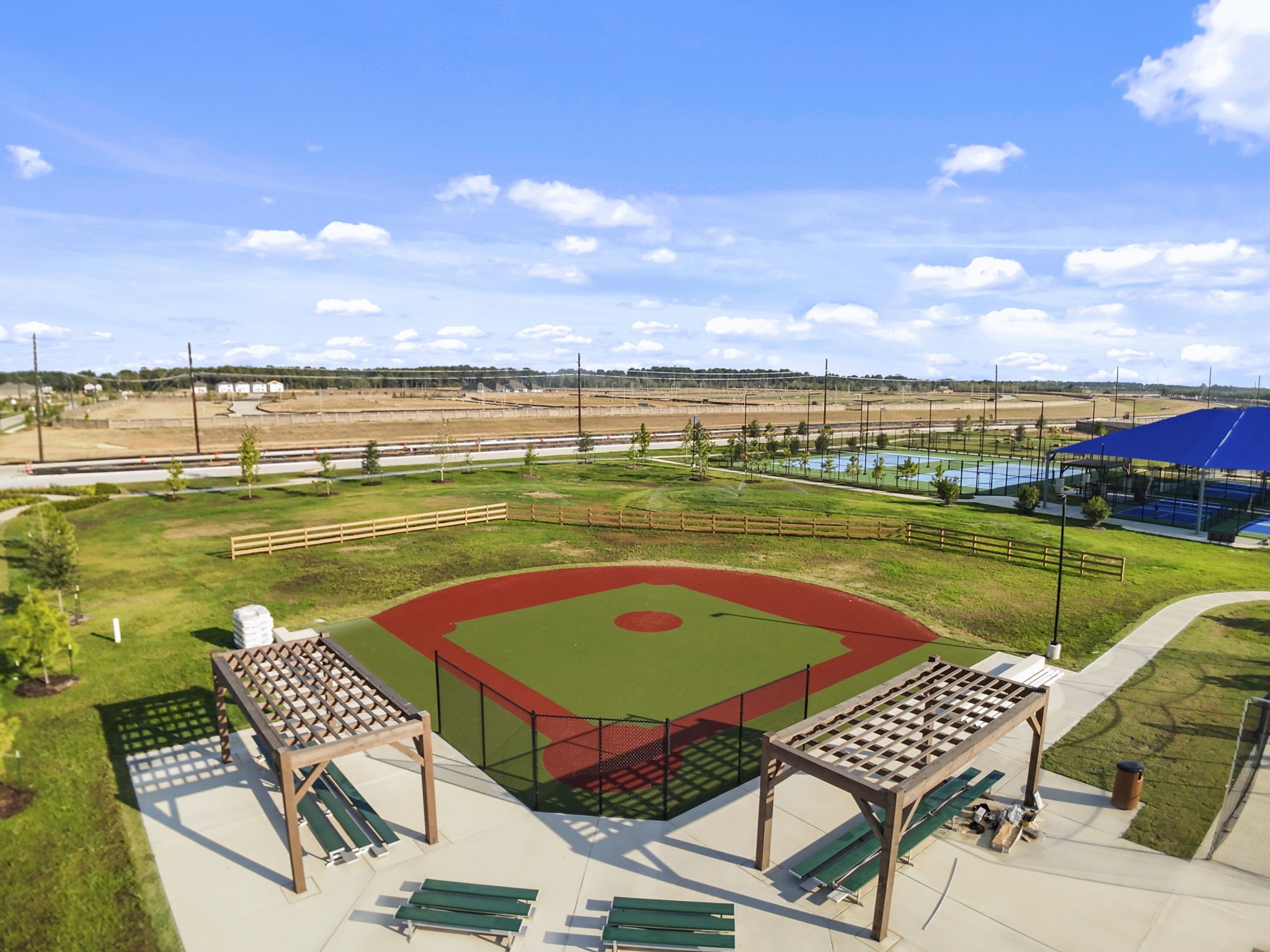22223 Rome Breeze Drive Hockley, TX 77447 - Photo 36 of 46 Community amenities include a baseball field where residents can enjoy friendly games or cheer on local teams. With shaded seating areas and open surroundings, it’s perfect for outdoor fun and connection.