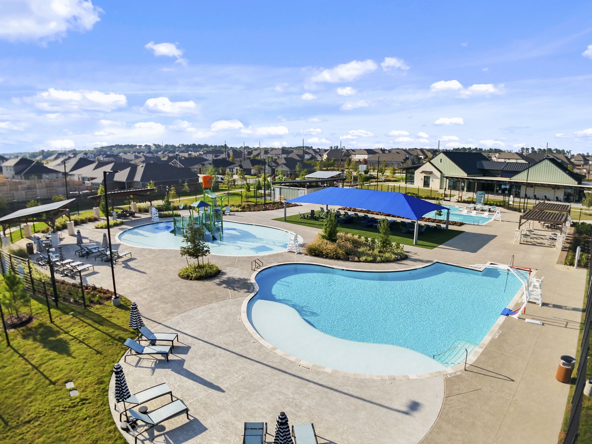 22223 Rome Breeze Drive Hockley, TX 77447 - Photo 41 of 46 The sparkling resort-style pool features gentle curves, tanning ledges, and plenty of lounge seating. It’s the perfect spot to cool off, soak up the sun, or spend the weekend relaxing with family and friends.