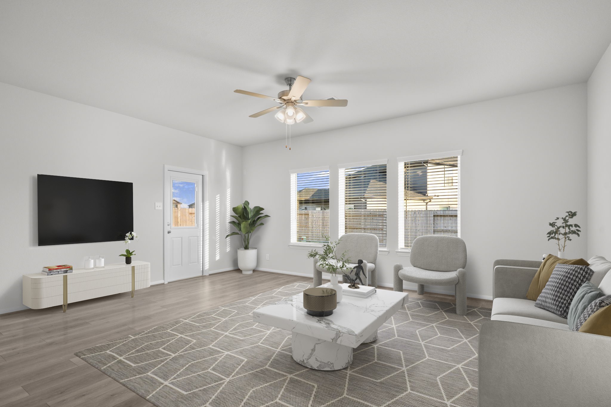 22223 Rome Breeze Drive Hockley, TX 77447 - Photo 7 of 46 Another virtually staged view of the family area highlights how beautifully the space connects to the dining and kitchen zones. The modern ceiling fan, soft neutral tones, and wide plank flooring create a warm and welcoming atmosphere throughout.