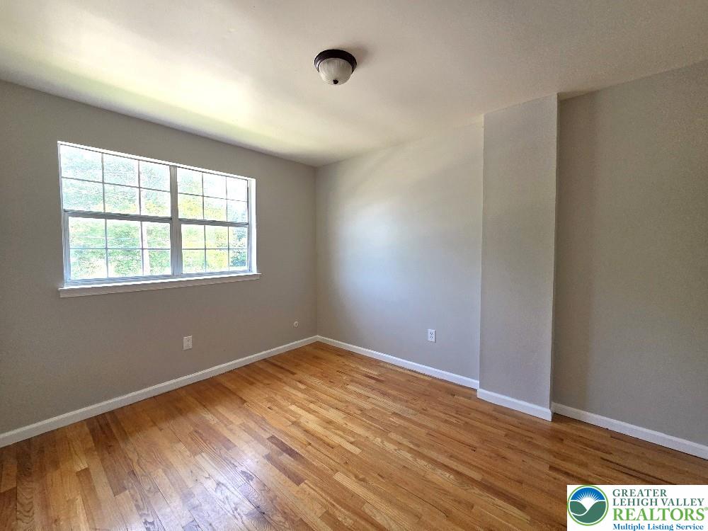 1747 Schoenersville Road Bethlehem, PA 18018 - Photo 12 of 13 Bright hardwood floors and a generous window create an inviting atmosphere.