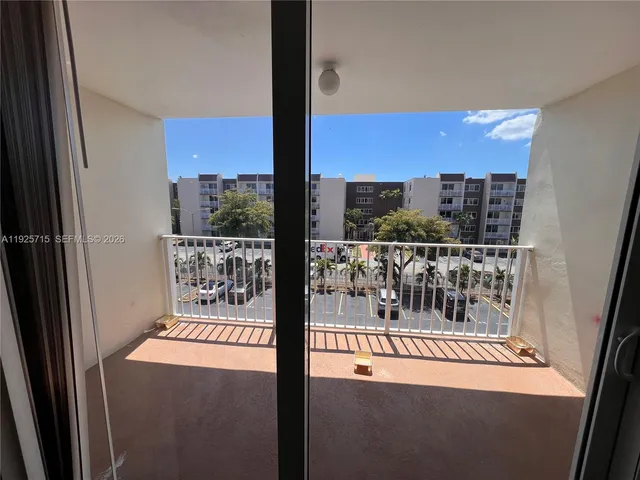 a kitchen with a sink stove and white cabinets
