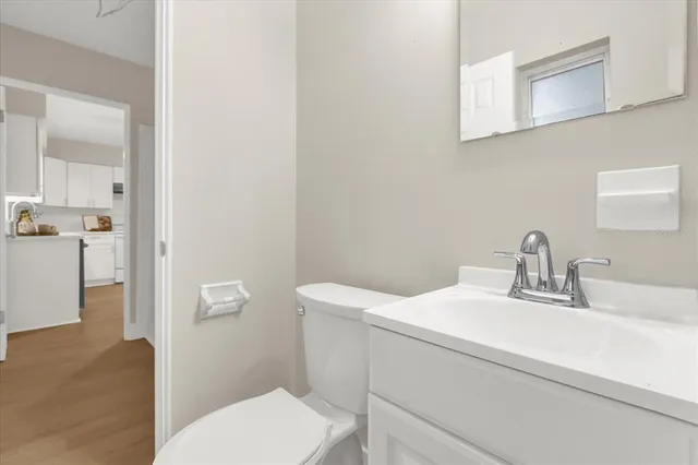 a view of washer and dryer with kitchen in the background