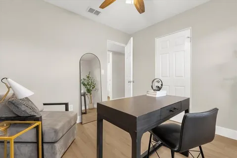 a workspace with furniture and window