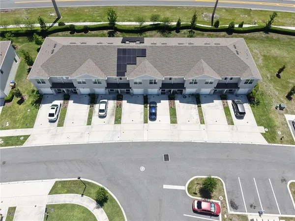 an aerial view of a house with pool