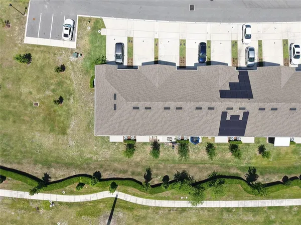 an aerial view of a house with a swimming pool