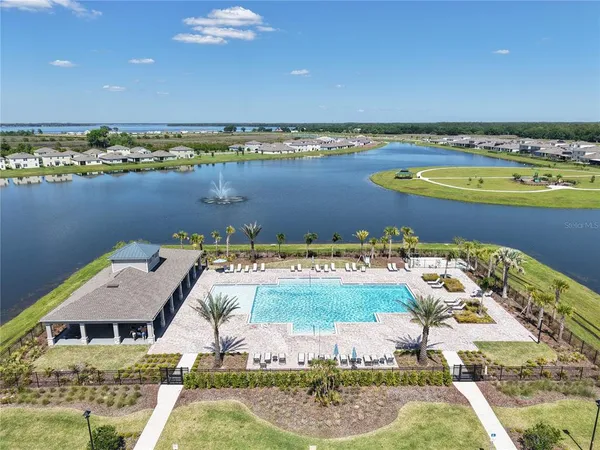 an aerial view of a house with lake view