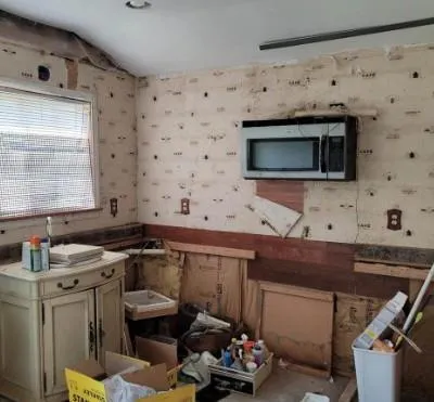 a kitchen with a sink appliances and cabinets