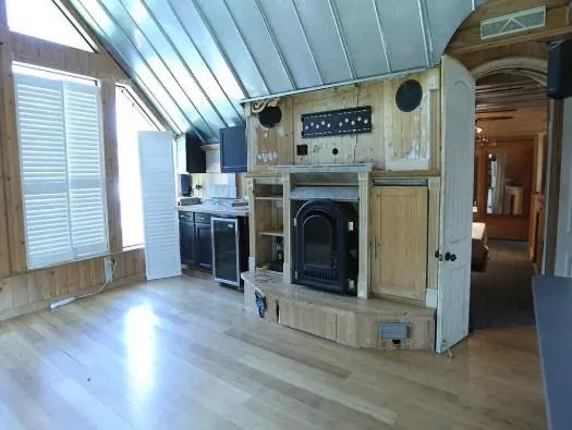 a view of a livingroom with furniture and a fireplace