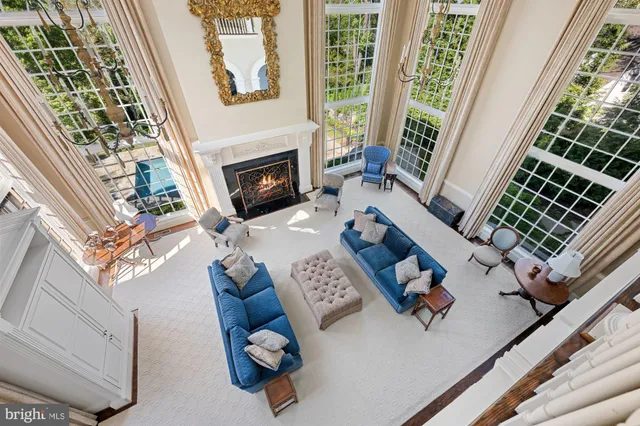a view of living room with furniture and a fireplace