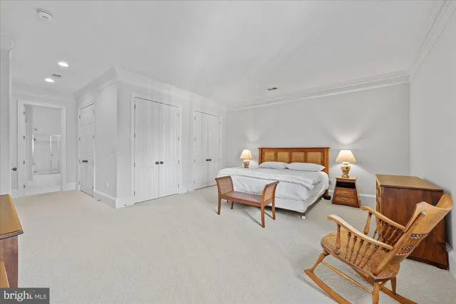 a bedroom with a bed and a couch