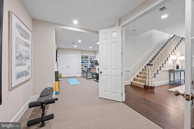 a view of entryway wih livingroom and stairs