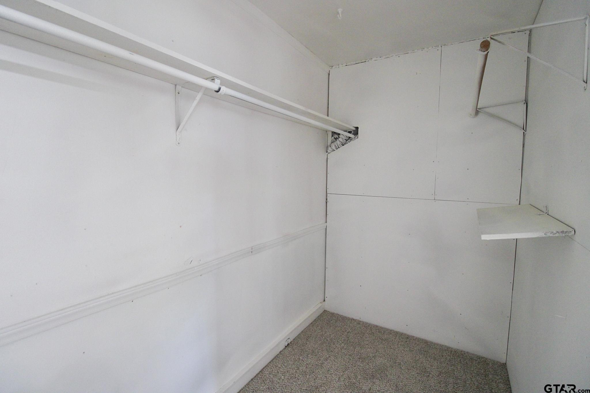 407 Pace Street Naples, TX 75568 - Photo 20 of 31 a view of a room with racks on the wall
