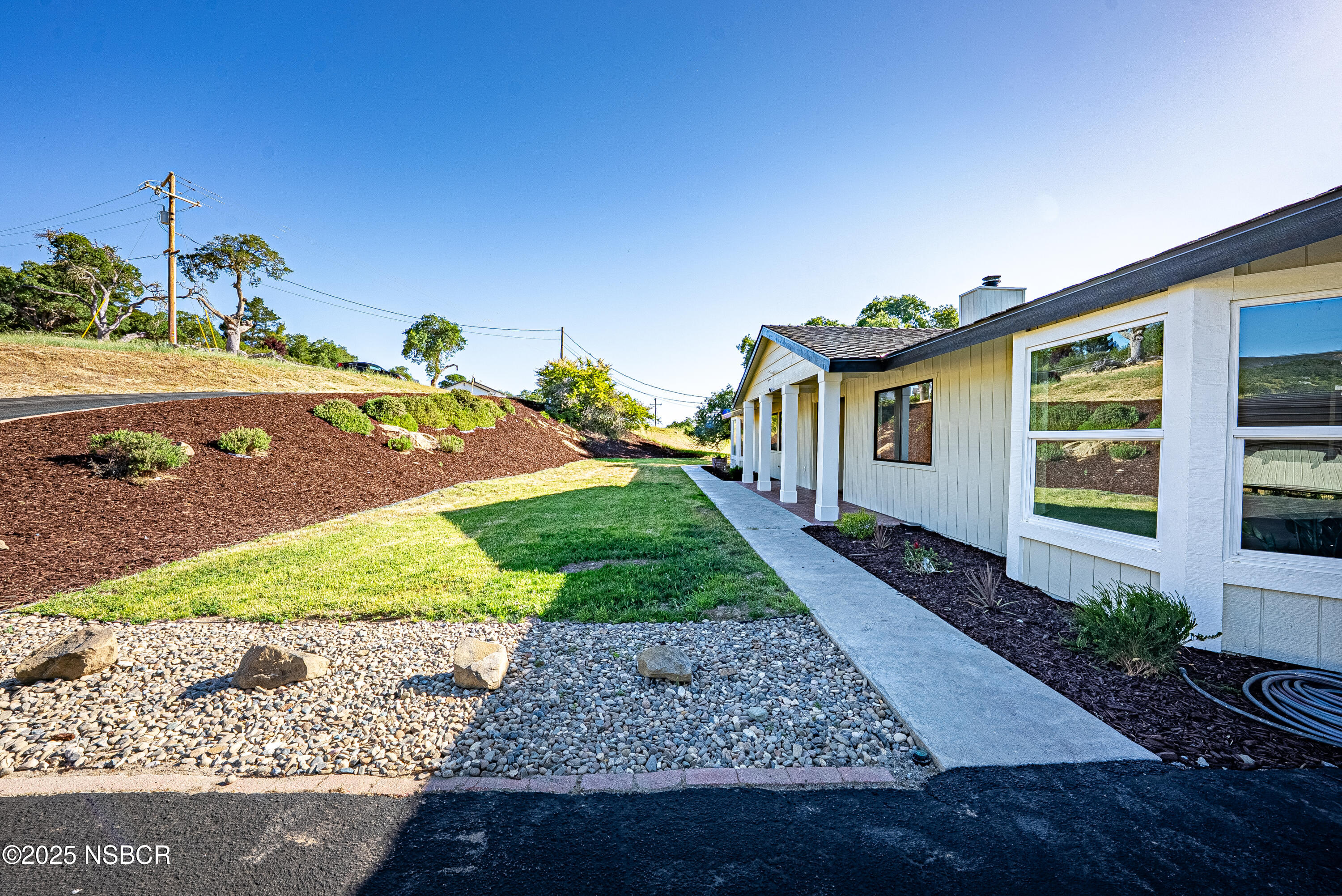 10095 San Marcos Road Atascadero, CA 93422 - Photo 12 of 58 a front view of a house with garden