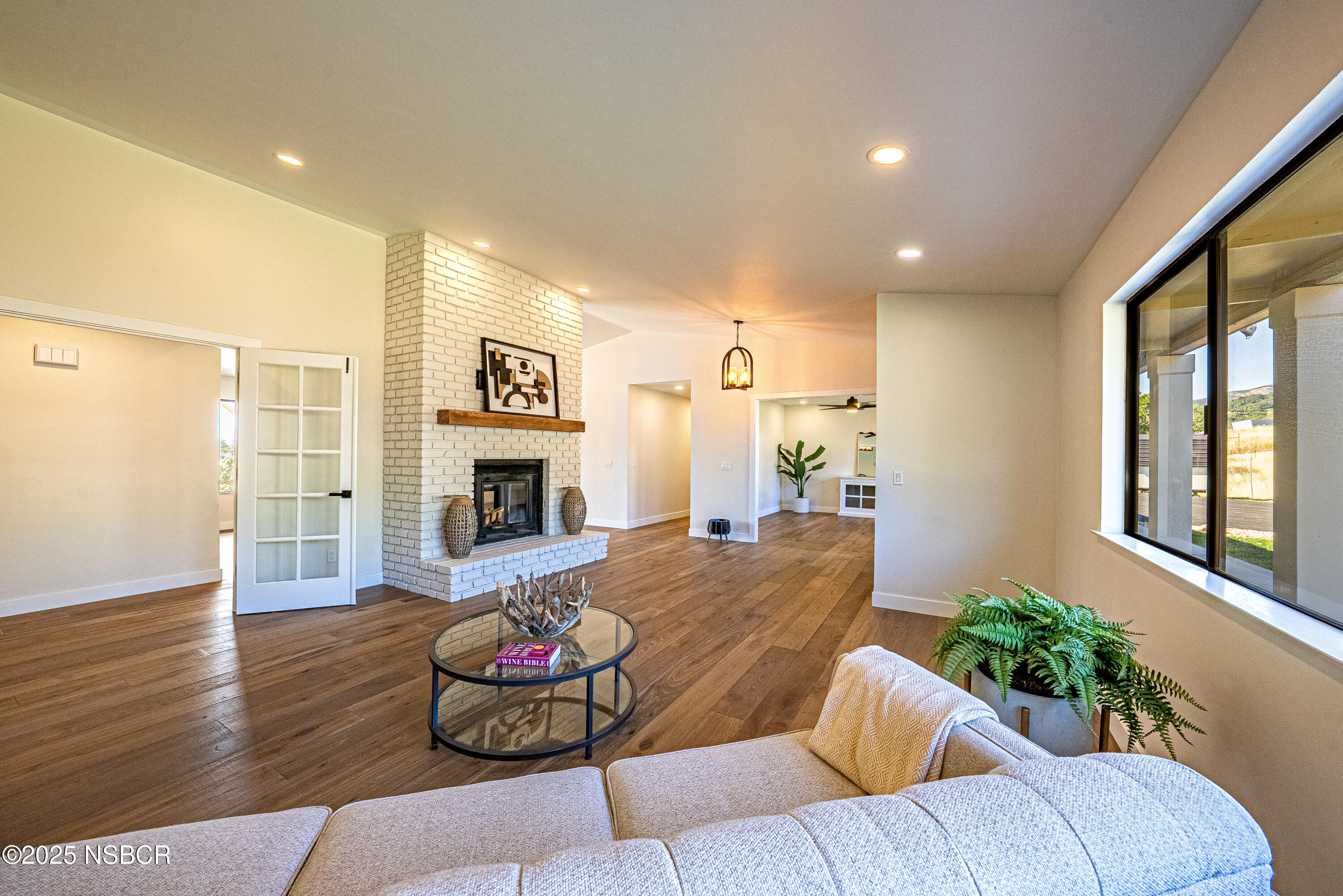 10095 San Marcos Road Atascadero, CA 93422 - Photo 24 of 58 a living room with furniture fireplace and flat screen tv