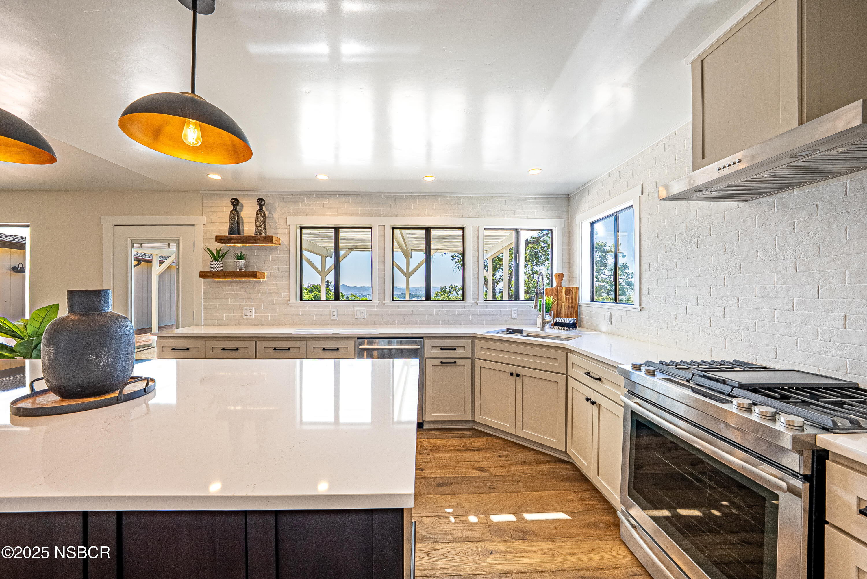 10095 San Marcos Road Atascadero, CA 93422 - Photo 29 of 58 a kitchen with stainless steel appliances granite countertop a stove a sink and a microwave