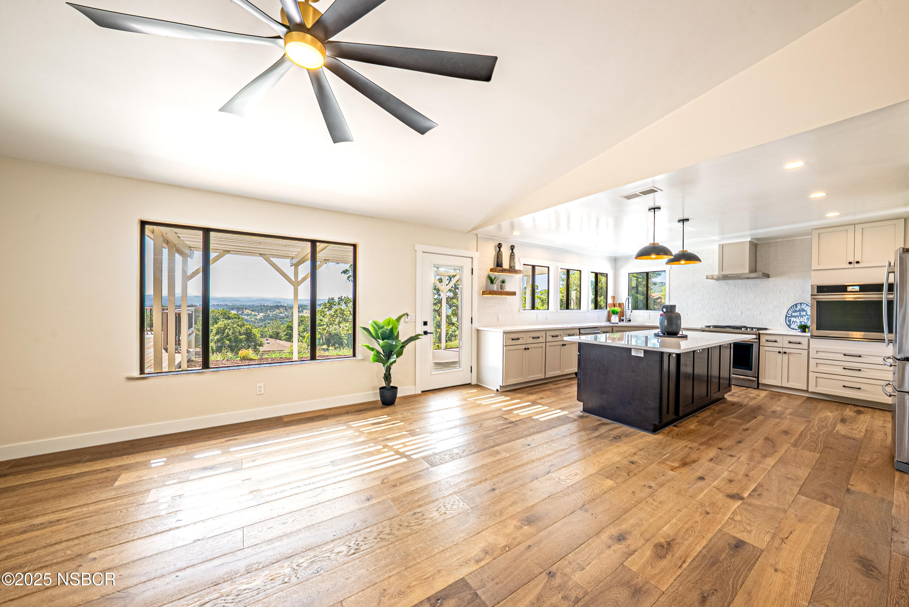 10095 San Marcos Road Atascadero, CA 93422 - Photo 34 of 58 a large kitchen with stainless steel appliances kitchen island a large counter top and sink