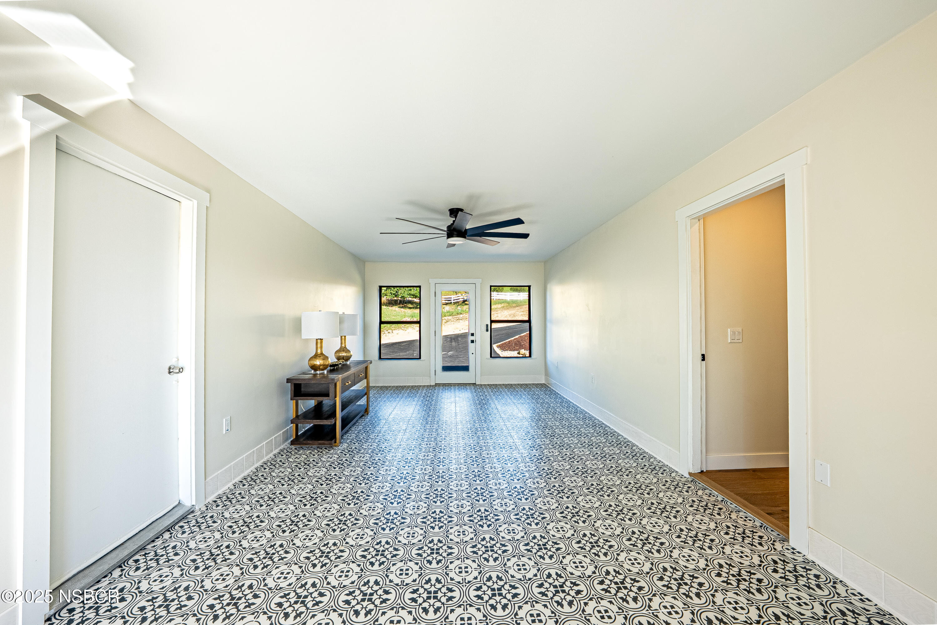 10095 San Marcos Road Atascadero, CA 93422 - Photo 37 of 58 a living room with furniture and a chandelier