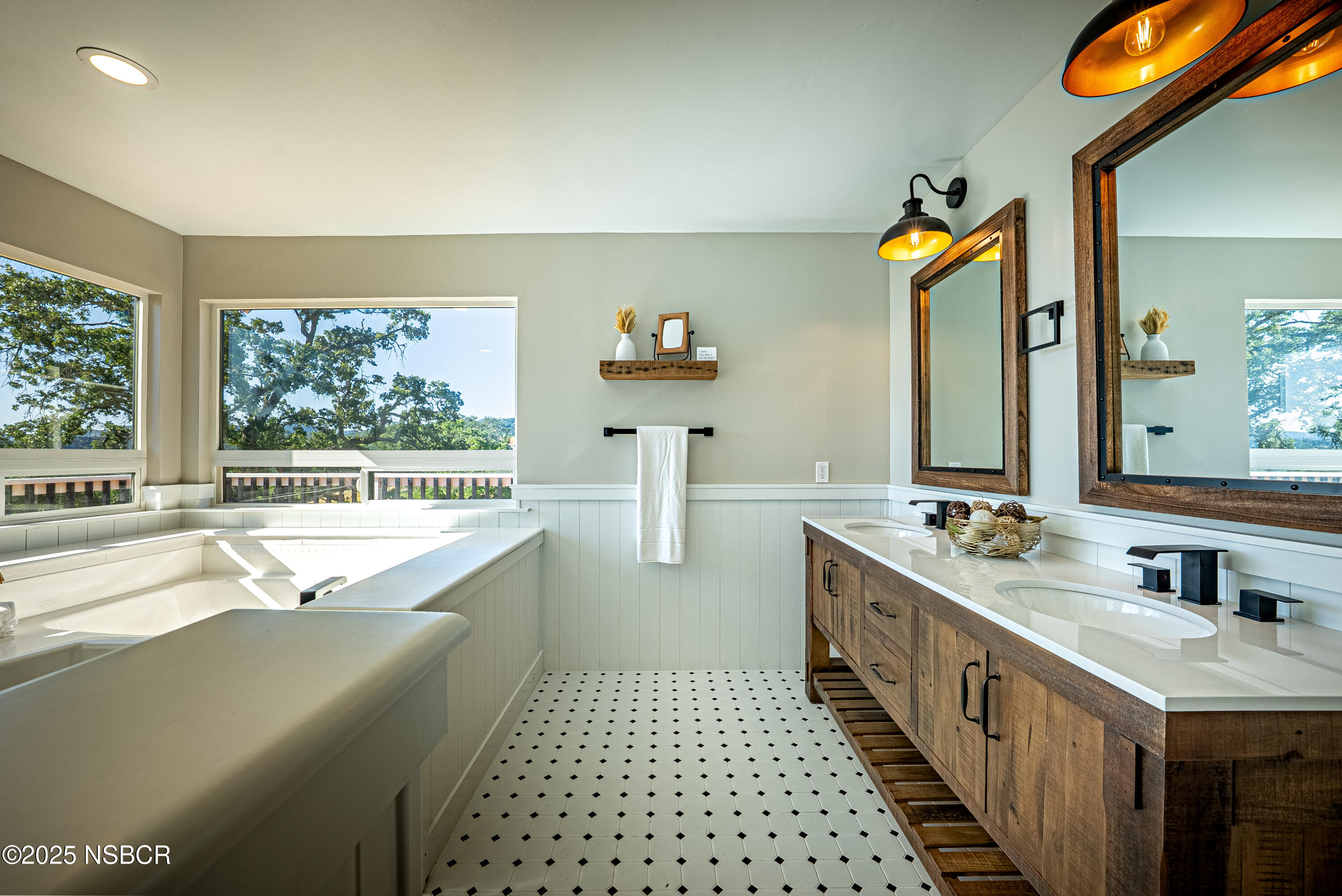 10095 San Marcos Road Atascadero, CA 93422 - Photo 42 of 58 a bathroom with a double vanity sink a large mirror and a bathtub