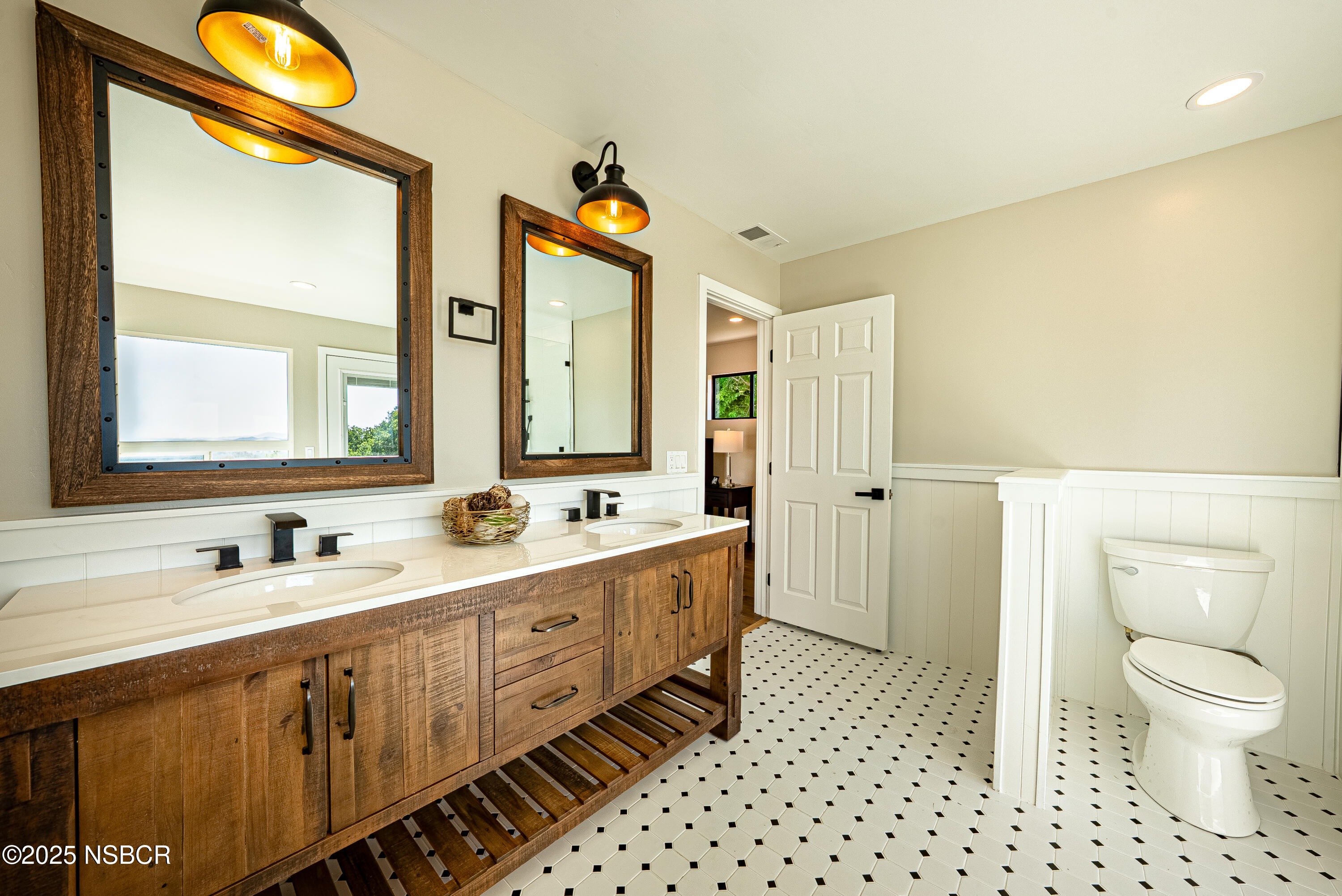 10095 San Marcos Road Atascadero, CA 93422 - Photo 43 of 58 a spacious bathroom with a double vanity sink toilet mirror and shower