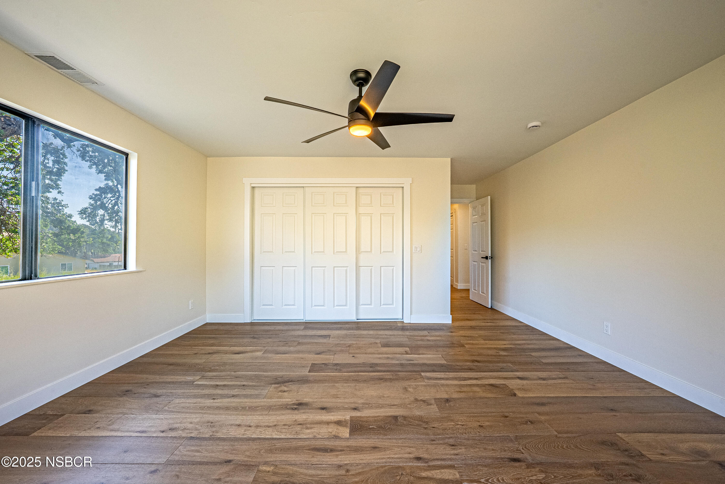 10095 San Marcos Road Atascadero, CA 93422 - Photo 53 of 58 a view of empty room with wooden floor and fan