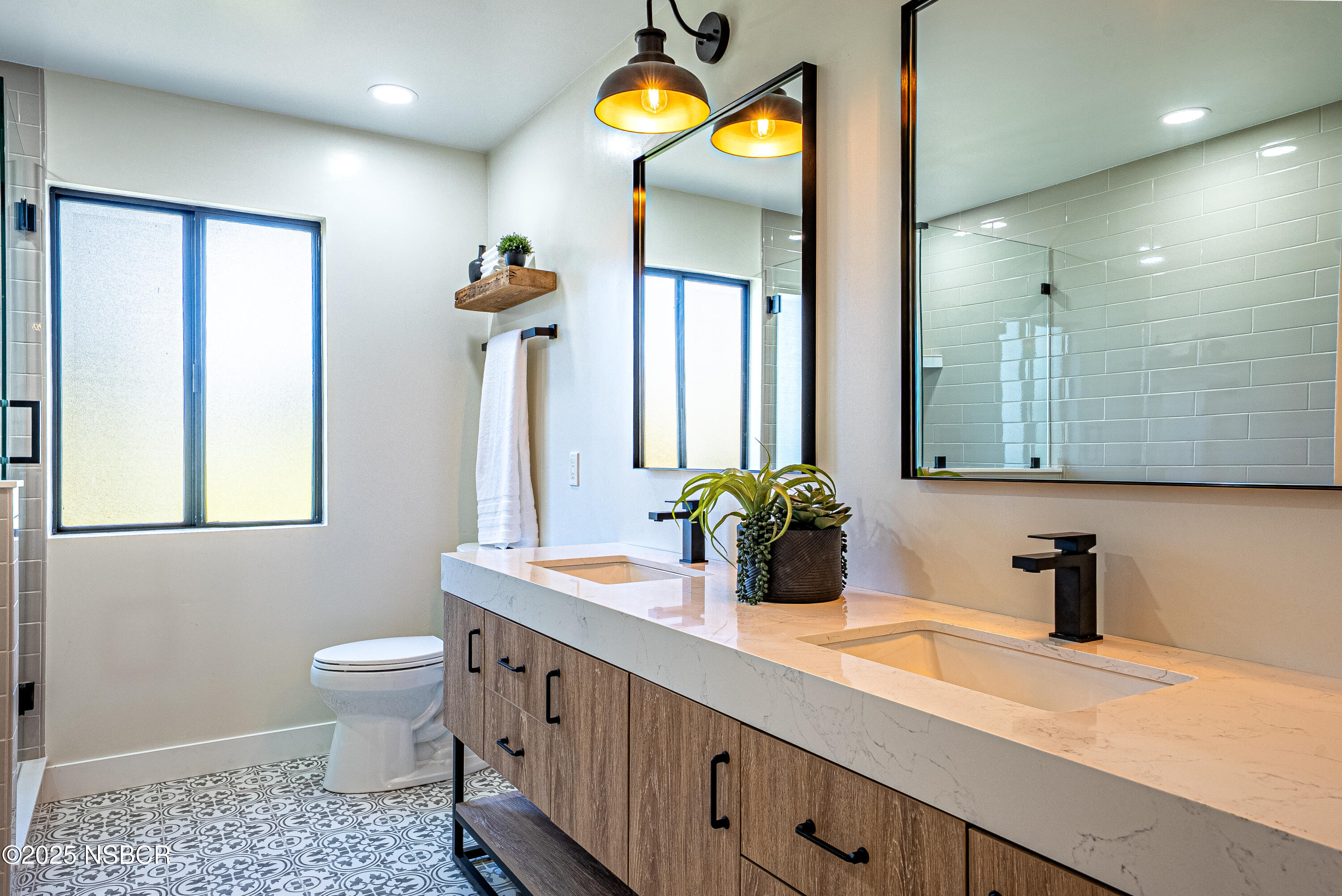 10095 San Marcos Road Atascadero, CA 93422 - Photo 54 of 58 a bathroom with a sink a toilet and mirror