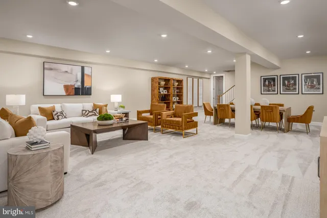 a living room with furniture and a table