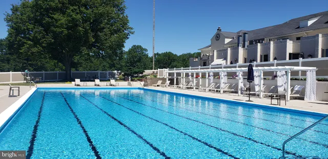 a view of swimming pool with outdoor seating